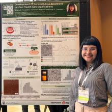 Ariane Fernandes standing in front of her winning poster